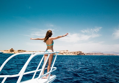 Female enjoying sunshine on a boat